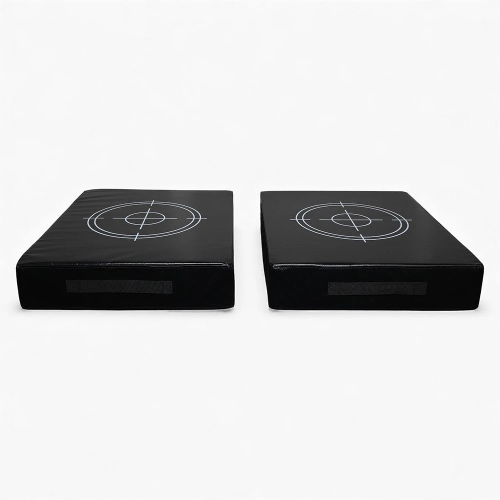 Two black square weight drop pads with target designs on a white background