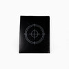 Black target-shaped object on a white background