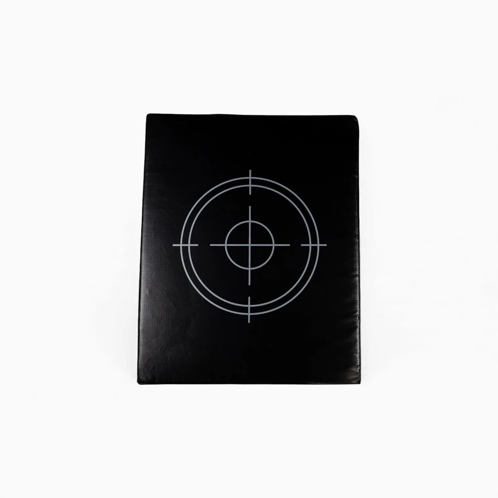 Black target-shaped object on a white background