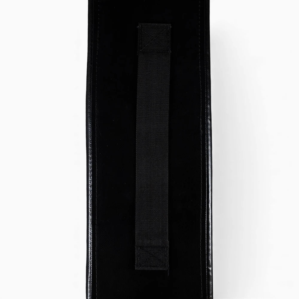 Close-up of a black weights pad with a visible brand logo on a white background