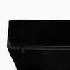 Close-up of a black weight drop pad with a zipper on a white background