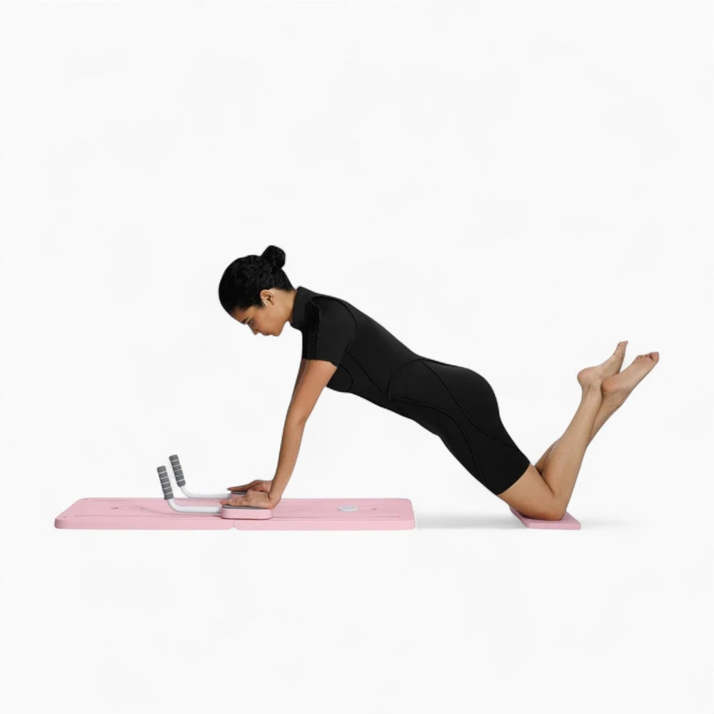 Woman using a pilates reformer board on a white background