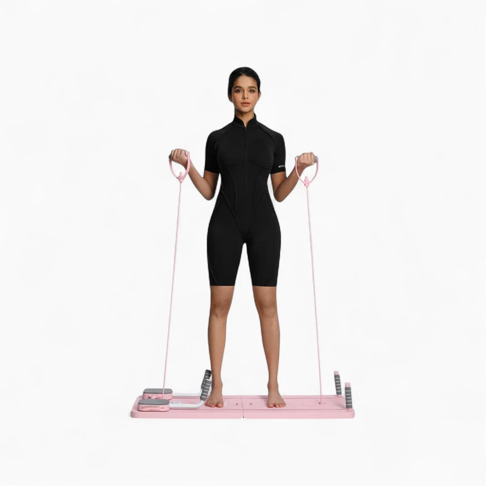 Woman using a pink pilates reformer board on a white background
