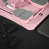 Pink pilates exercise board with gray components on a black surface