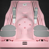 Pink and gray pilates reformer exercise board on a black background