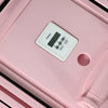 Close up of a pink pilates reformer machine

