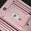 Pink pilates reformer board with digital timer  on a dark background