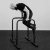 Person using a black exercise bar on a plain background