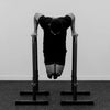 Man on pull up bar in a black and white tone