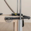 Foot bar adjustment on a pilates cadillac and reformer machine