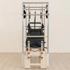 Pilates reformer machine on a beige background
