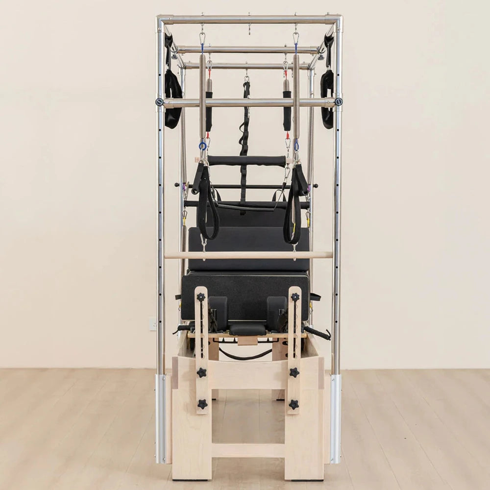 Pilates reformer machine on a beige background