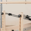 Pulley and riser system at the head end of pilates reformed machine