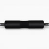 Black squat pad over a barbell on a white background
