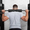 Man using soft squat pad for heavy weight lifting