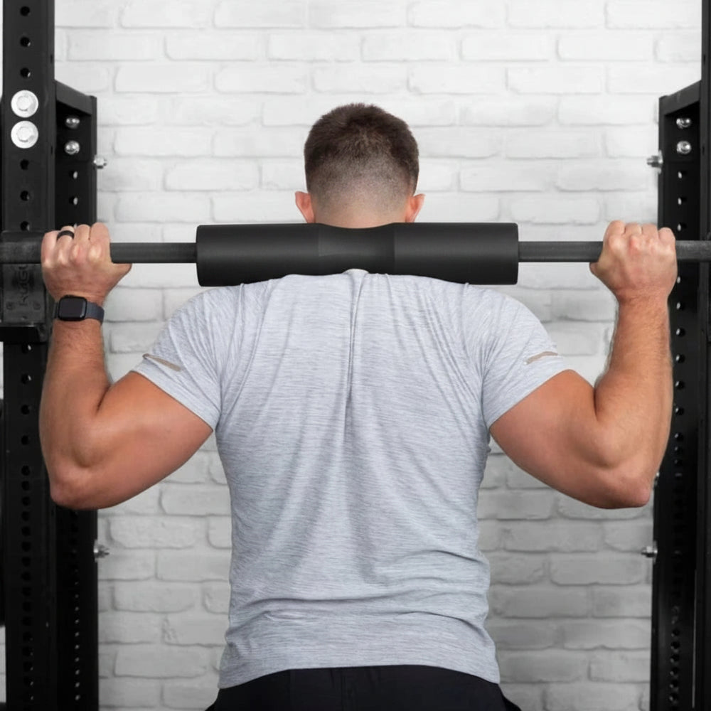 Man using soft squat pad for heavy weight lifting