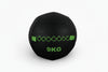 Black wall ball with green accents on a white background