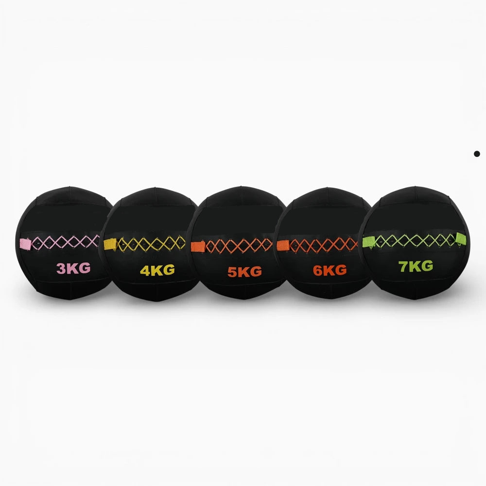 Set of five black weighted balls with color-coded weight labels on a white background