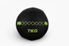 Black wall ball with '7KG' marking on a white background