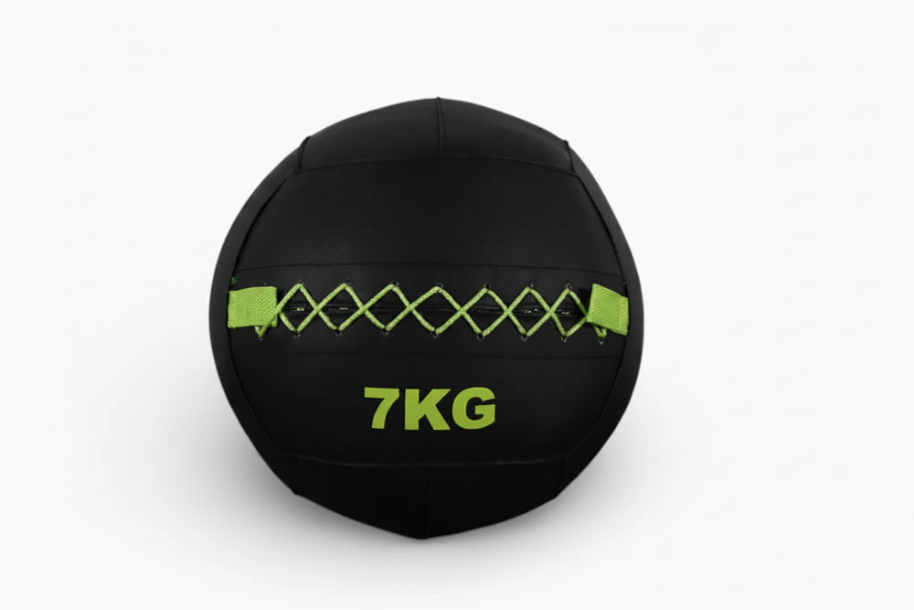Black wall ball with '7KG' marking on a white background