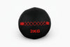 Black slam ball with red accents on a white background