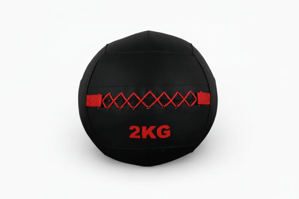 Black slam ball with red accents on a white background