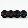 Four black weighted balls with different weights on a white background