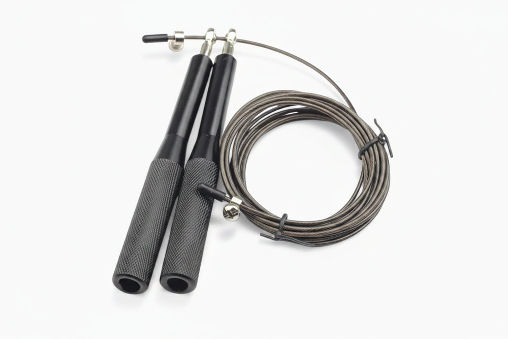 Black jump rope with metal clasps on a white background