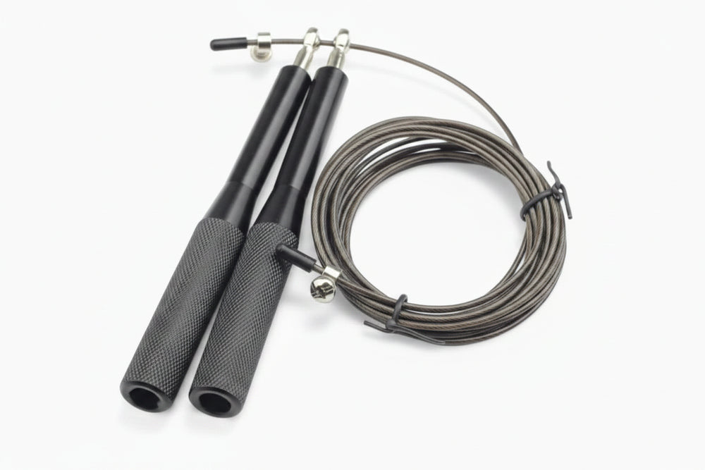 Black jump rope with metal clasps on a white background