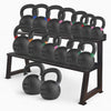 Fully loaded kettlebell weights storage rack on a white background