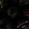 Black wall balls with weight markings on a dark background