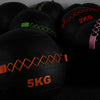 Group of black wall balls with different coloured accents