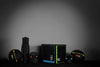 Bundle of gym equipment, kettlebells, slam balls, gym mat at gym block on a dark background