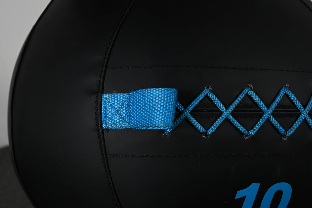 Black slam ball with blue accents on a dark background