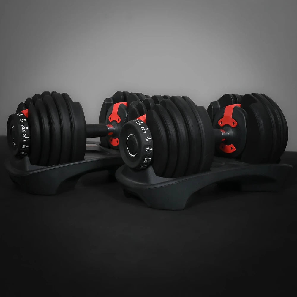 Pair of adjustable dumbbells on a dark background