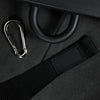 Detailed image of black belt strap and carabiner on a dark background