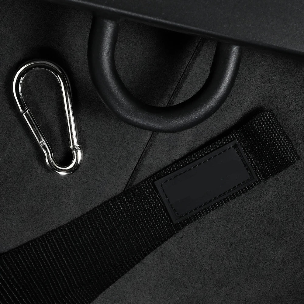 Detailed image of black belt strap and carabiner on a dark background