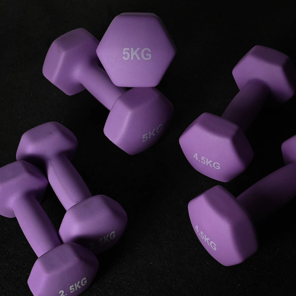 Purple dumbbells with weight markings on a black background