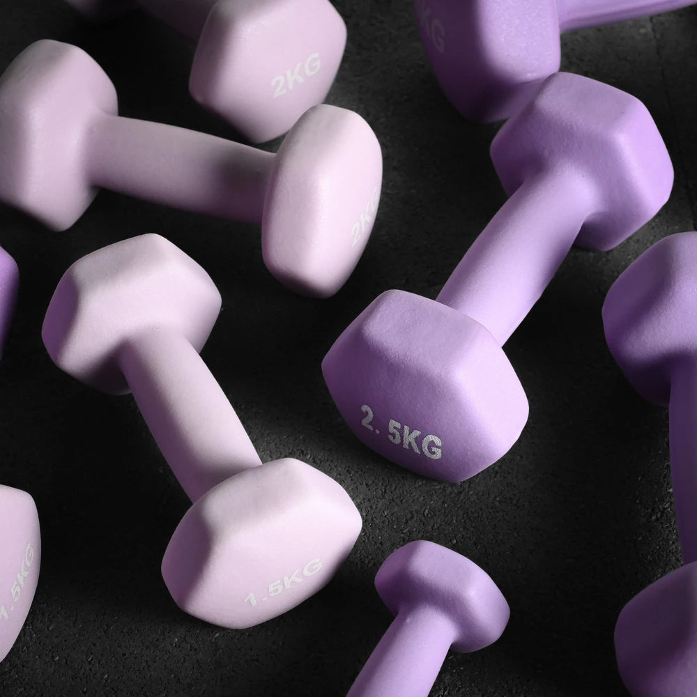 Purple dumbbells scattered on a dark floor