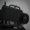 Close-up of a textured grip foot plate of a leg press hack squat machine on a gray background
