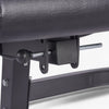 Locking pin on a leg extension machine on a white background