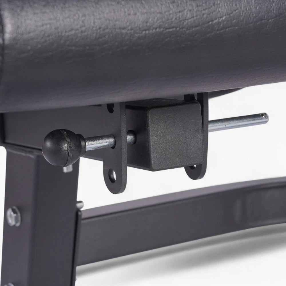 Locking pin on a leg extension machine on a white background