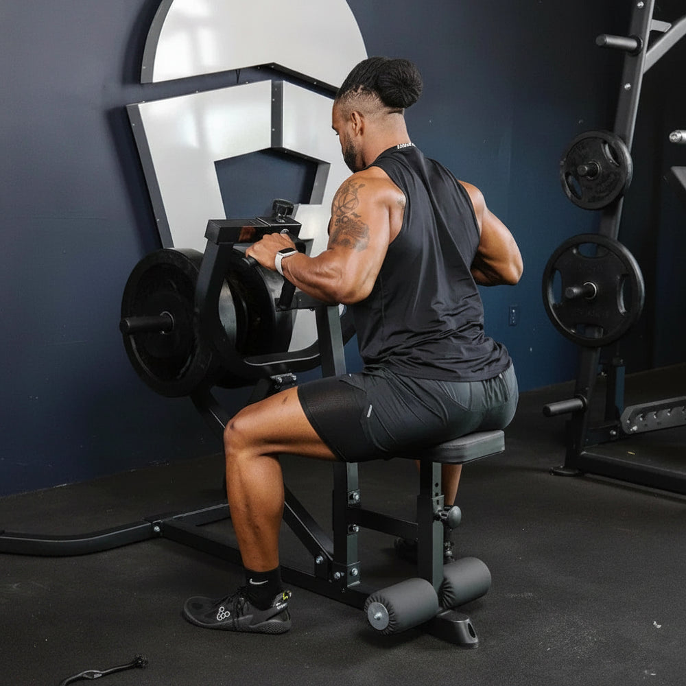 Man exercising on a weight machine in a gym setting