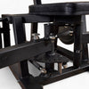 Close-up of a black metal mechanical adjustment of a gym machine on a white background 