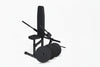 Black weight dip machine with weight plates on a white background