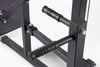 Close-up of a black metal exercise machine on a white background