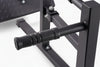 Close-up of a black metal pull-up bar on a white background
