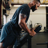 Man exercising on a machine in a gym setting