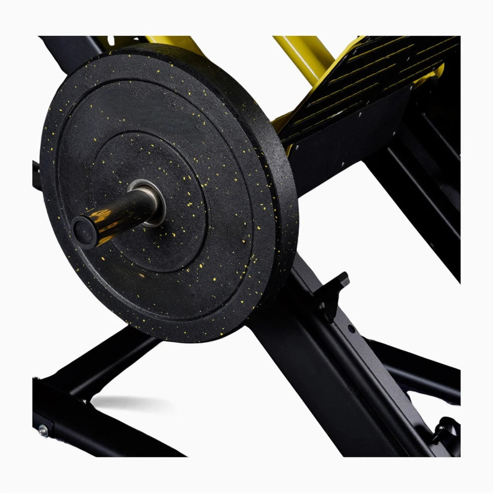 Close-up of a weight plate on a weightlifting bench with a white background