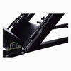 Close-up of a black metal frame of a leg press with mechanical components on a white background